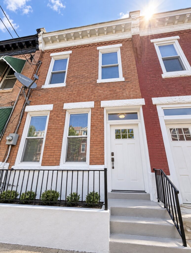 Conceptual finished exterior of 2443 N 30th Street in Philadelphia after planned porch, railing, window and facade improvements